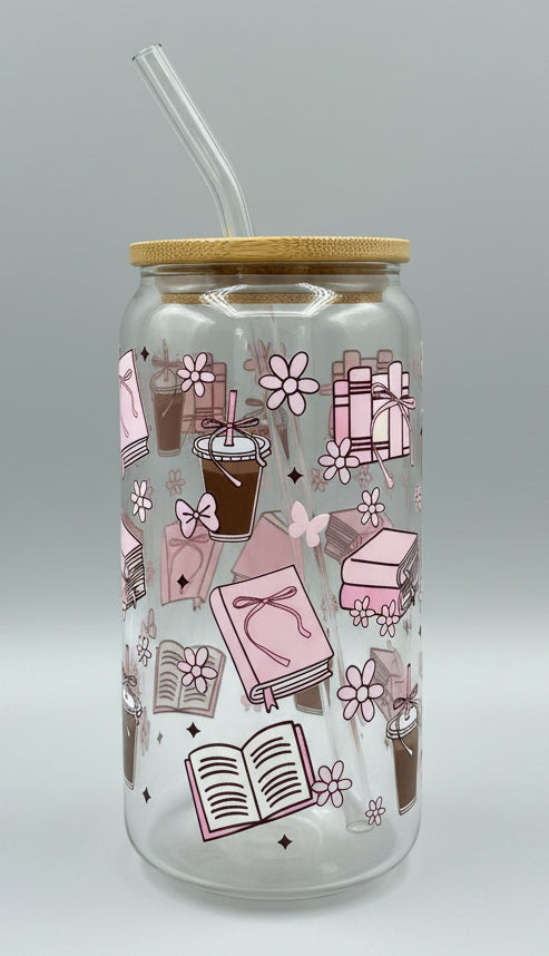 glass cup with pink books, bows, butterflies, coffee