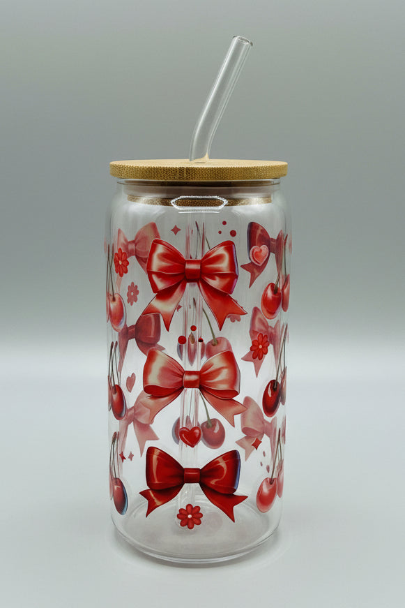 red bows and cherries on glass cup
