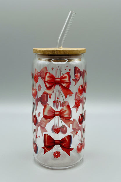 red bows and cherries on glass cup