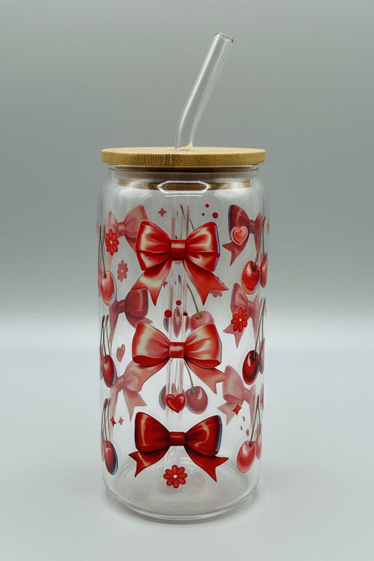 red bows and cherries on glass cup