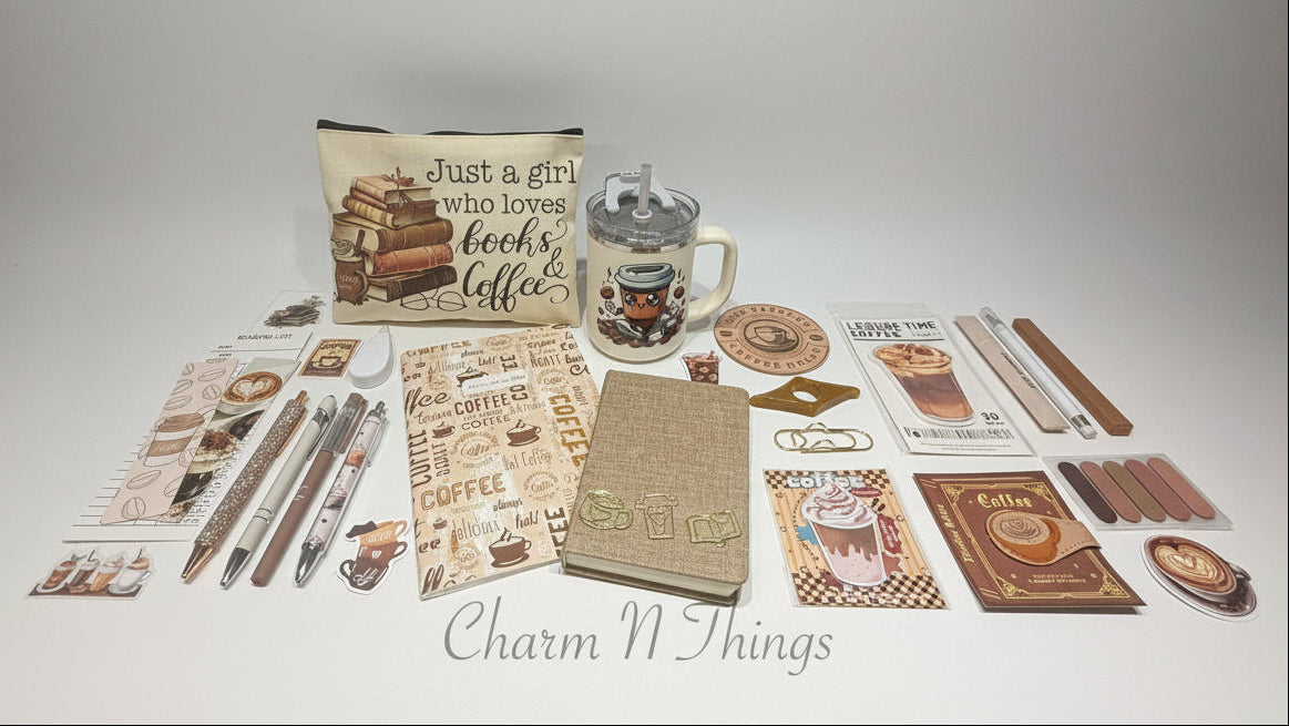 stationary items including journal paper, stickers, and a mug on a table with storage drawers in the background.