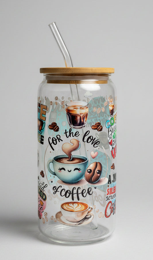 Glass tumbler with coffee-themed illustrations and text on a wooden surface outdoors.