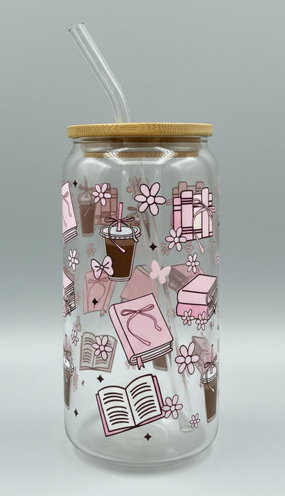 glass cup with pink books, bows, butterflies, coffee