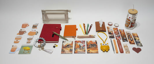 fall inspired stationary set with red notebook, orange notebook, glass cup